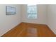 Cozy bedroom with natural light, wood flooring, and neutral walls at 2928 Seasons Blvd, Sarasota, FL 34240