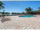 Relaxing community pool with scenic lake views and comfortable lounge seating at 2928 Seasons Blvd, Sarasota, FL 34240
