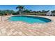Inviting community pool offers a refreshing escape with lounge chairs and scenic views at 2928 Seasons Blvd, Sarasota, FL 34240