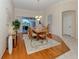 Inviting dining room with wood flooring, a stylish chandelier, and sliding glass doors to the lanai at 2928 Seasons Blvd, Sarasota, FL 34240