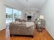 Bright living room featuring glass sliders to screened pool, and built-in entertainment center at 2928 Seasons Blvd, Sarasota, FL 34240