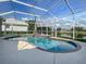 The screen-enclosed pool has a spa and stunning water views at 2928 Seasons Blvd, Sarasota, FL 34240