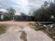 Modest single-story home with distinctive stone facade and a covered porch at 3010 17Th St, Sarasota, FL 34234