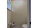 Powder room with a toilet, small cabinet, and minimal decor at 3139 Point St, North Port, FL 34286