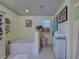 Bathroom featuring a soaking tub, tiled floor, and a separate shower at 3139 Point St, North Port, FL 34286