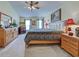 Well-lit bedroom featuring a bed, two dressers, and zebra-themed decorations and art at 3139 Point St, North Port, FL 34286