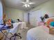 Nicely decorated bedroom featuring two twin beds, desk, and ample closet space at 3139 Point St, North Port, FL 34286