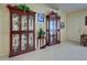 Elegant entryway boasts tile floors, two china cabinets, and decorative accents offering a warm welcome at 3139 Point St, North Port, FL 34286