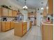 Large kitchen boasts ample cabinet space, an island, and modern appliances, perfect for cooking and entertaining at 3139 Point St, North Port, FL 34286