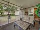 Inviting screened lanai with a seating area and outdoor access at 3139 Point St, North Port, FL 34286