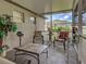 Cozy screened lanai featuring comfortable seating and outdoor views at 3139 Point St, North Port, FL 34286