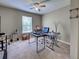 Functional office space with multiple workstations, a window for natural light, and neutral decor at 3139 Point St, North Port, FL 34286