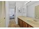 Bright bathroom featuring a single sink vanity and neutral counter tops and decor at 330 Mission N Trl # B, Venice, FL 34285