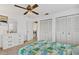 Well-lit bedroom with 2 closets and neutral walls and flooring at 330 Mission N Trl # B, Venice, FL 34285