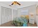 Cozy bedroom with neutral walls and carpet, has 2 large closets and bright lighting at 330 Mission N Trl # B, Venice, FL 34285