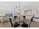 Open-concept living and dining area features ample natural light and neutral decor at 330 Mission N Trl # B, Venice, FL 34285