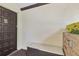 Condo front door with decorative glass, exterior storage, and small garden on a sunny day at 330 Mission N Trl # B, Venice, FL 34285