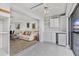 Sunroom with tile floor that seamlessly connects to the living room at 330 Mission N Trl # B, Venice, FL 34285