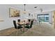 Comfortable living space flows into a dining area with views of the outdoors at 330 Mission N Trl # B, Venice, FL 34285