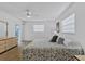 The main bedroom features a ceiling fan, plenty of natural light, and neutral walls at 330 Mission N Trl # B, Venice, FL 34285