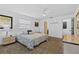 The main bedroom includes a ceiling fan, natural light, and neutral color palette at 330 Mission N Trl # B, Venice, FL 34285