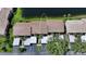 An aerial view of townhouses with a lake view and covered parking spots at 330 Mission N Trl # F, Venice, FL 34285