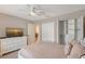 Comfortable bedroom featuring a large bed, dresser with TV, and closet at 330 Mission N Trl # F, Venice, FL 34285