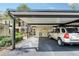 Carport parking with well-maintained landscaping near the front of the property at 330 Mission N Trl # F, Venice, FL 34285
