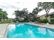 Relaxing community pool area with lounge chairs and an outdoor gazebo at 330 Mission N Trl # F, Venice, FL 34285