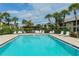 Resort-style pool with plenty of lounge chairs and shady seating areas at 330 Mission N Trl # F, Venice, FL 34285
