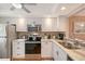 Modern kitchen featuring sleek appliances, countertops, and efficient layout at 330 Mission N Trl # F, Venice, FL 34285