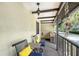 Cozy covered porch with outdoor seating and a vintage-style light fixture at 330 Mission N Trl # F, Venice, FL 34285