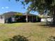 Wide backyard featuring patio and ample green space at 3601 Point St, North Port, FL 34286