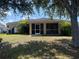 Image of backyard showing covered patio and yard space at 3601 Point St, North Port, FL 34286