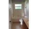 Bathroom featuring tiled floors and walls, tub and shower combination and single sink vanity at 3601 Point St, North Port, FL 34286