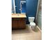 This bathroom offers a vanity with storage, toilet, and shower at 3601 Point St, North Port, FL 34286