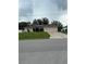 Charming single-story home featuring a two-car garage and solar panels for energy efficiency at 3601 Point St, North Port, FL 34286
