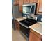 Updated kitchen featuring stainless steel appliances and ample counter space at 3601 Point St, North Port, FL 34286