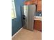 Spacious kitchen featuring stainless steel refrigerator and ample cabinet space at 3601 Point St, North Port, FL 34286