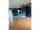 Open-concept living space with hardwood floors, kitchen bar and plenty of room at 3601 Point St, North Port, FL 34286