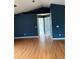 Large living room with hardwood floors and open doorways at 3601 Point St, North Port, FL 34286