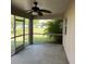 Screened patio offering an inviting space with views of the expansive yard and garden at 3601 Point St, North Port, FL 34286