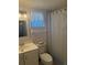 Bright bathroom featuring a white vanity and patterned shower curtain at 3697 Lake Bayshore Dr # H-109, Bradenton, FL 34205