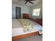 Bedroom features a bed, carpet, dresser, and plenty of space at 3697 Lake Bayshore Dr # H-109, Bradenton, FL 34205