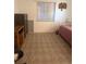 Bedroom with carpet and a window with blinds at 3697 Lake Bayshore Dr # H-109, Bradenton, FL 34205