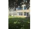 Exterior view of the building showcasing well-maintained landscaping at 3697 Lake Bayshore Dr # H-109, Bradenton, FL 34205