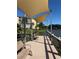 Inviting dock with comfortable seating and shaded canopy overlooking the lake at 3697 Lake Bayshore Dr # H-109, Bradenton, FL 34205
