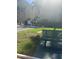 Well-maintained exterior with a green bench, grass and a fire hydrant at 3697 Lake Bayshore Dr # H-109, Bradenton, FL 34205