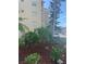 A beautiful view of the exterior of the building showing colorful plants and well maintained landscaping at 3697 Lake Bayshore Dr # H-109, Bradenton, FL 34205