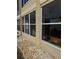 Exterior view of the building with large windows and attractive landscaping at 3697 Lake Bayshore Dr # H-109, Bradenton, FL 34205